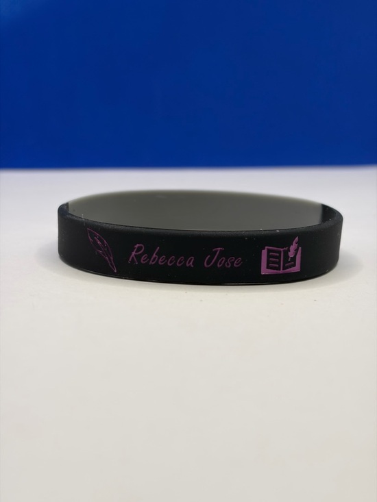 Jewelry - 💜 5/$15 - Rebecca Jose Author Black Silicone Wristband - Pink Accent